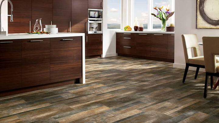 wood flooring in kitchen with waterfall countertops